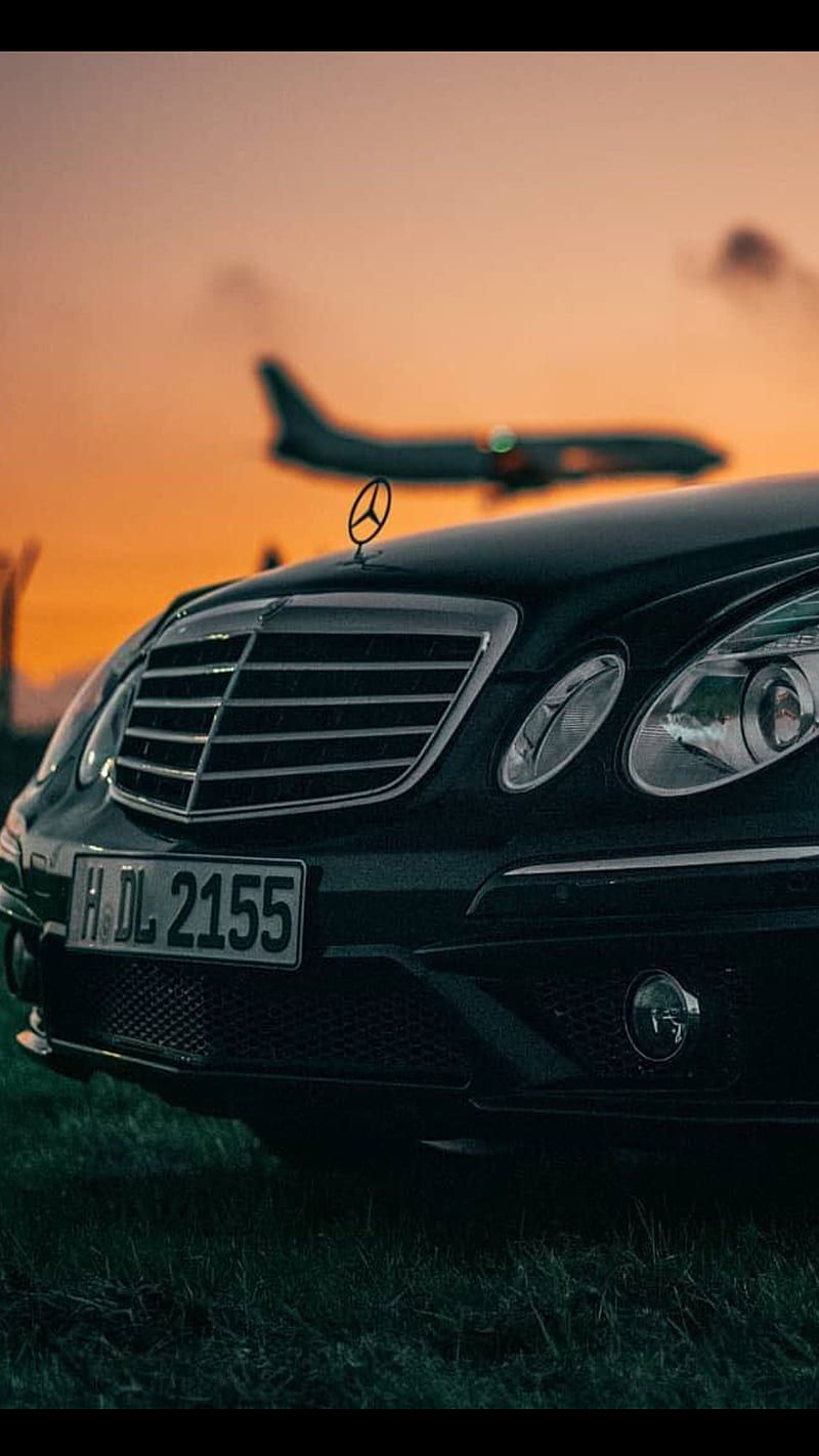 Mercedes-Benz E-Klasse, Kühlergrill, Flugzeug, Sonnenuntergang, Android-Hintergrundbild