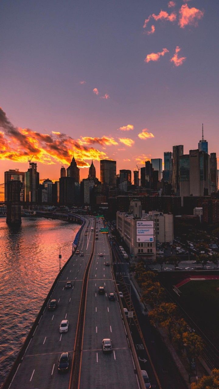Skyline, Sonnenuntergang, Fluss, Schnellstraße, Orange Himmel, Sperrbildschirm fürs iPhone