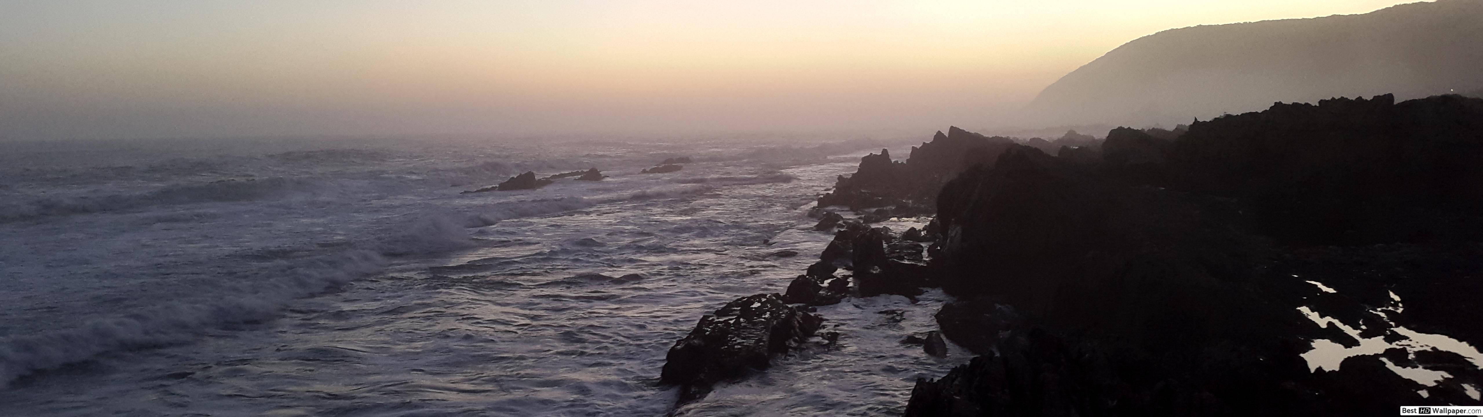 Felsküste, Sonnenuntergang, Meer, Silhouette, Panorama, 32:9, 2K-Hintergrundbild für den Desktop