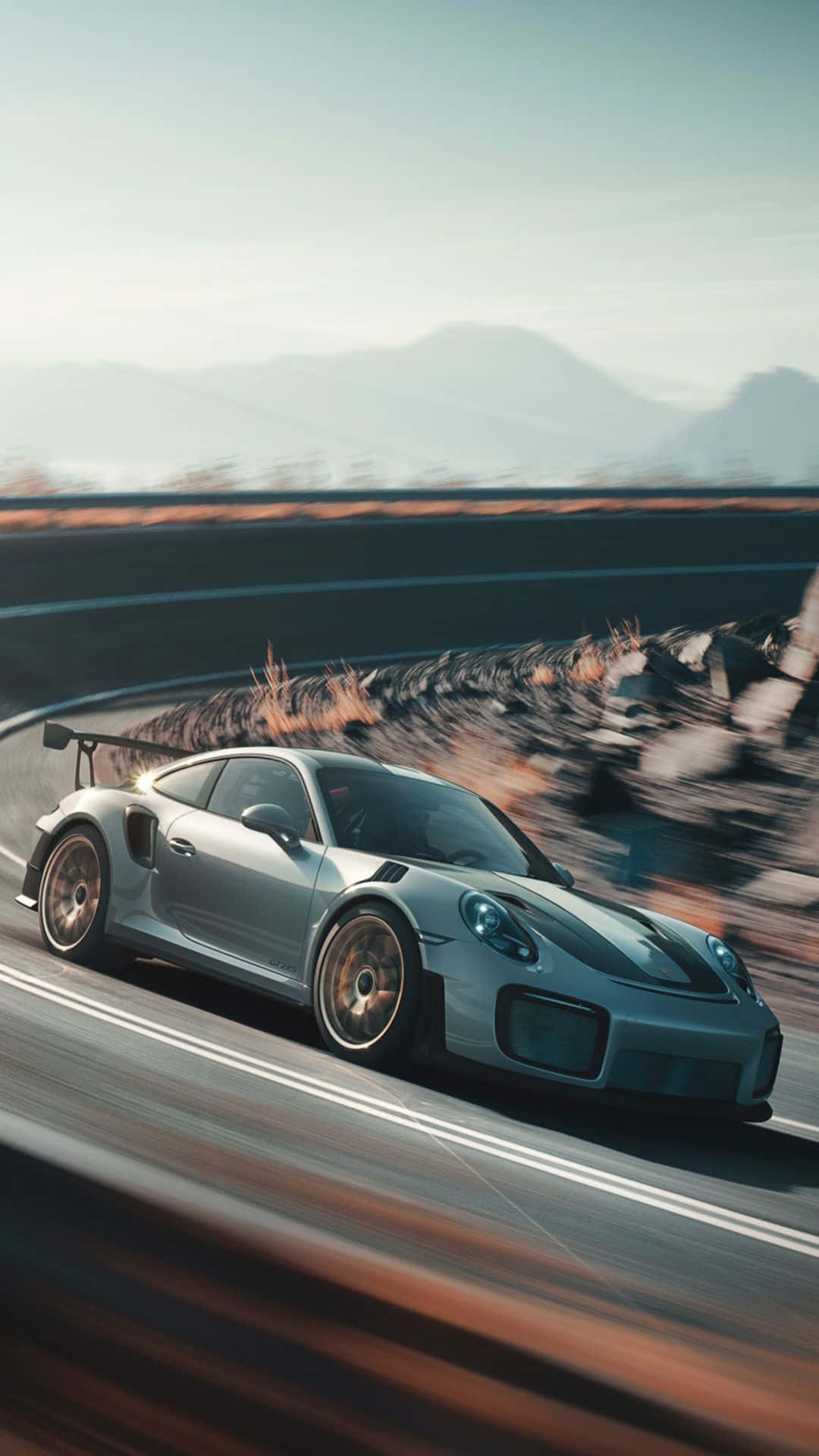 Porsche 911 GT3 RS, Grauer Sportwagen, Rennstrecke, Bewegungsunschärfe, Berge, Hochformat-Hintergrundbild