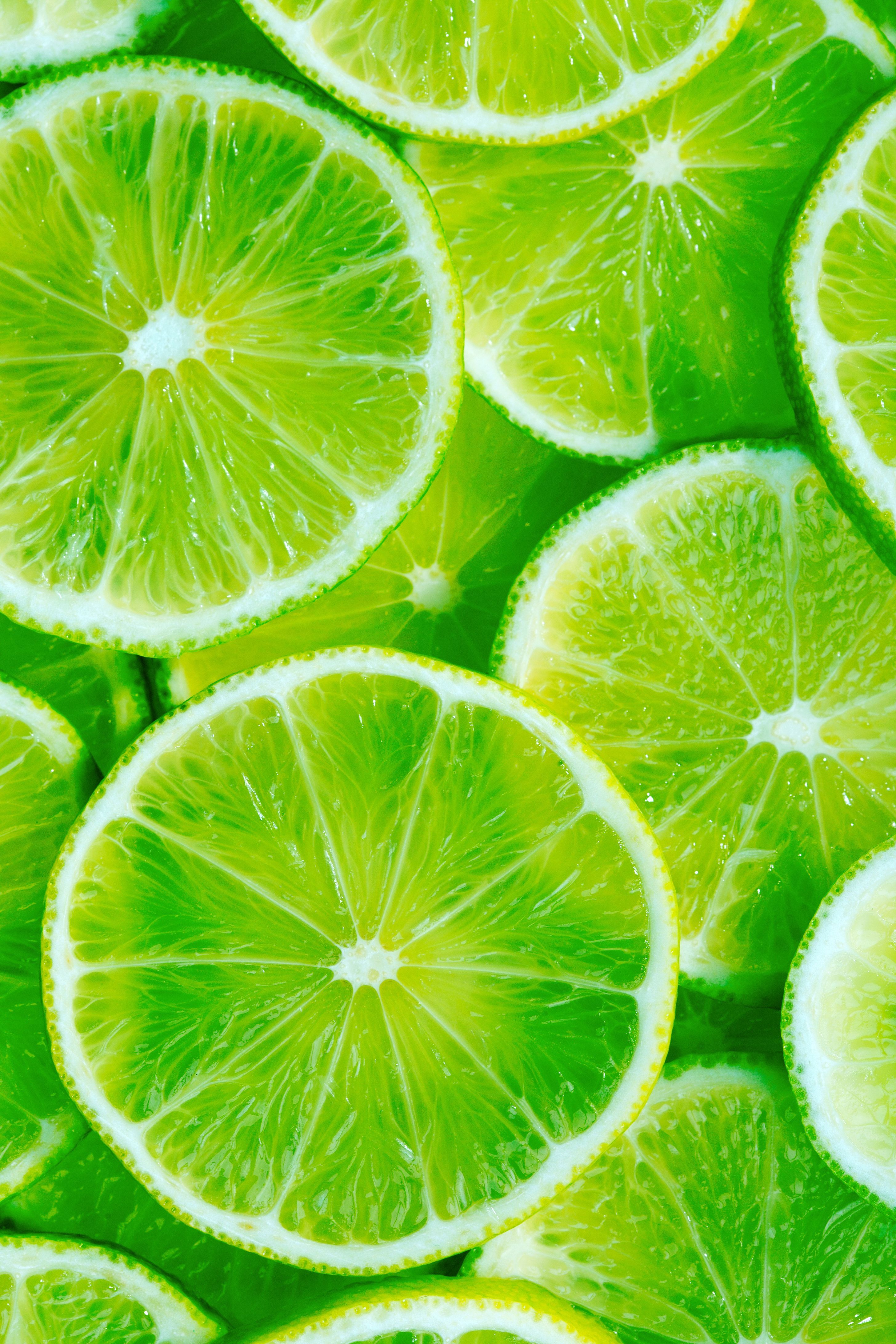 Limetten, Limettenscheiben, Zitrusfrüchte, Hellgrün, Nahaufnahme, QHD+, Handy-Hintergrund