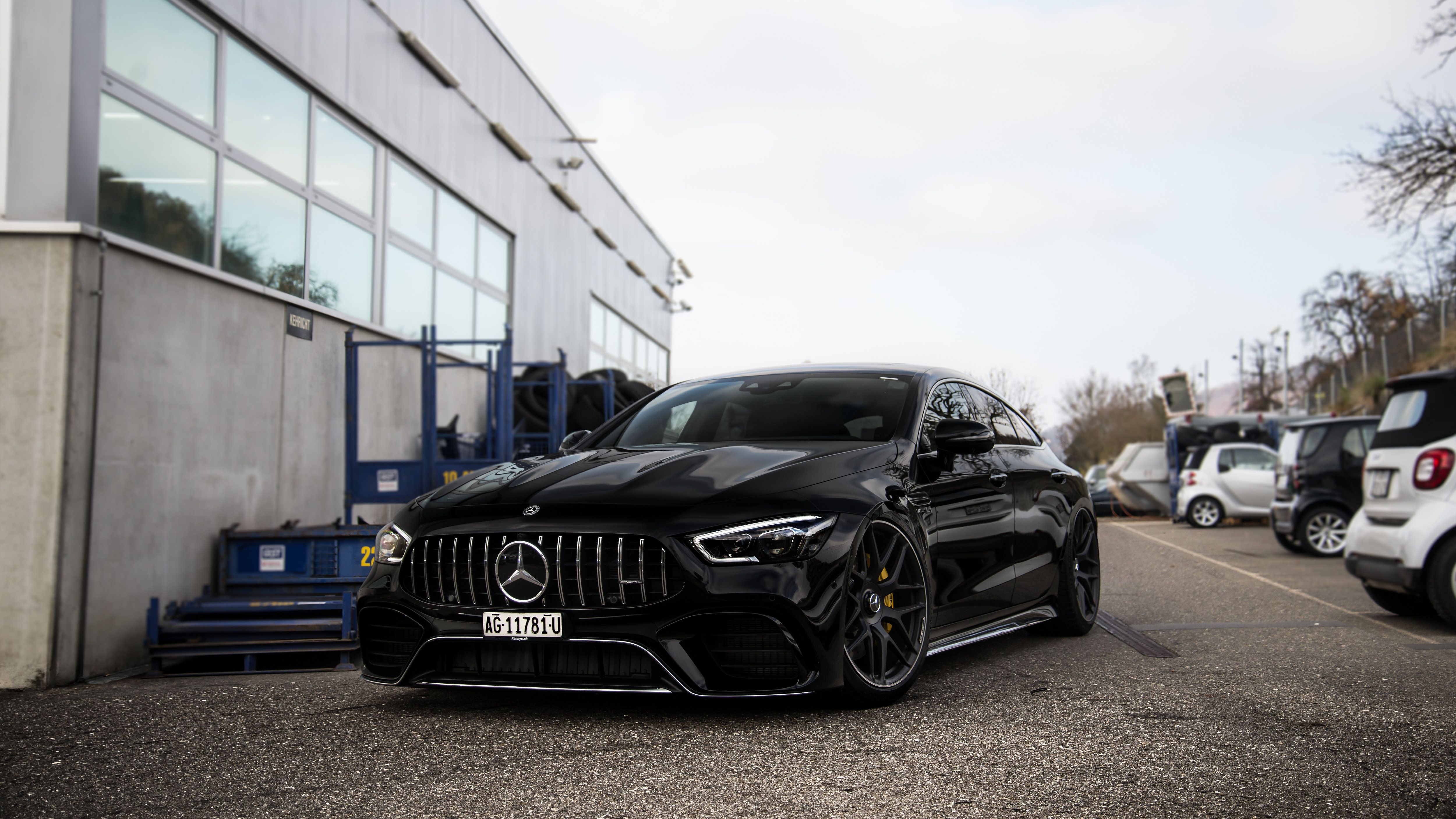 Mercedes-AMG GT 63 4-Türer, Mercedes-AMG, Schwarzes Auto, Parkplatz, Industriegebäude, 4K-Desktop-Hintergrund